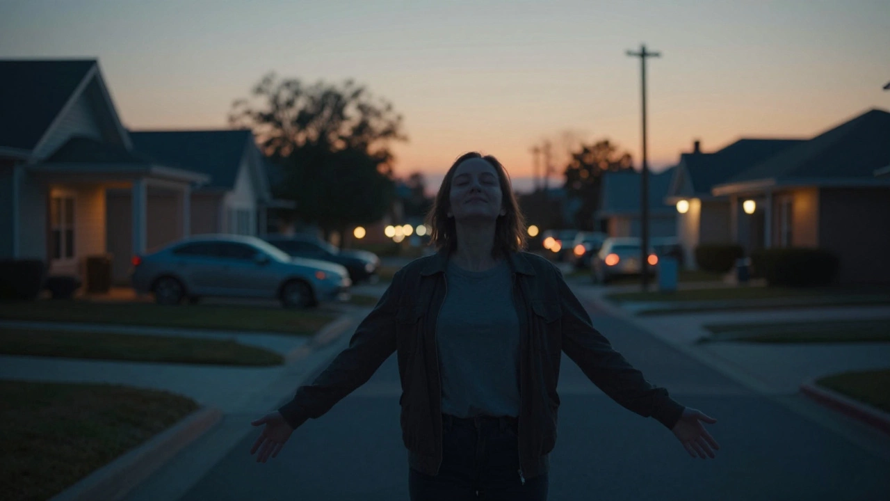 A person standing still in a driveway at dusk, breathing deeply, no devices, transitioning from work mode to personal time.
